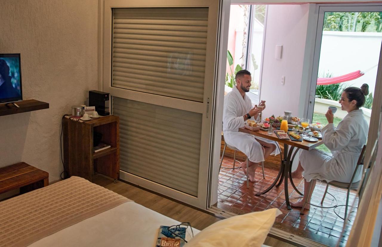 Hotel Boutique Frangipani Brotas Exterior foto A room at the hotel