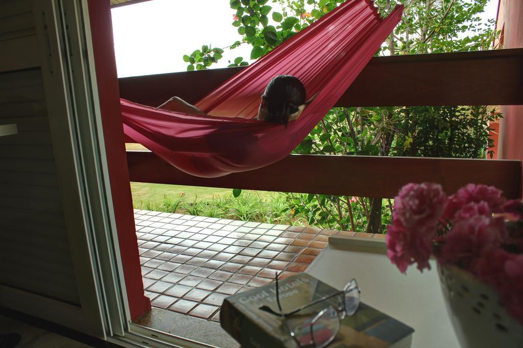 Hotel Boutique Frangipani Brotas Exterior foto A hammock on a balcony